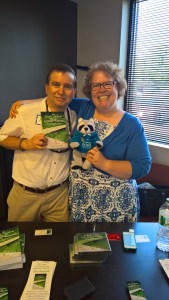 Karl and Angela Robb with Karl's book and Parky the Raccoon.