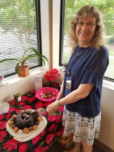 Sonia cutting giant donut cake